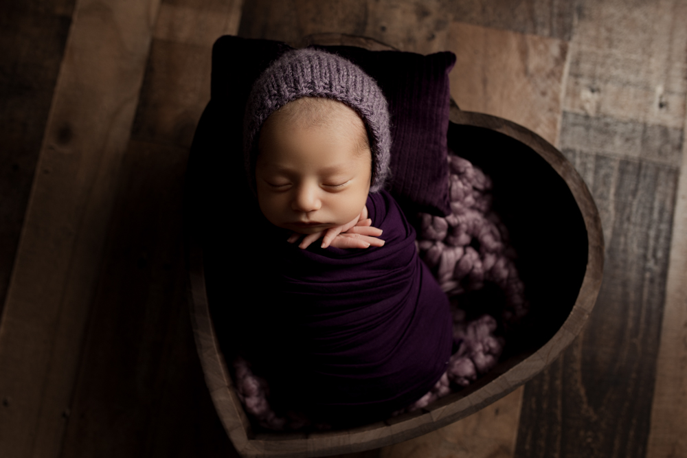 baby in heart bowl in purple
