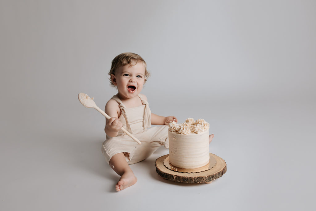 baby eating a cake during a cake smash session.