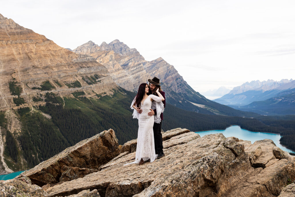 Couple enjoying the beautiful view on their elopement day in Banff National Park