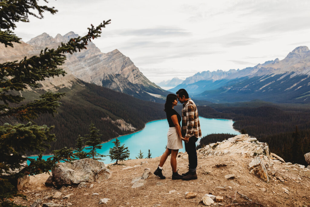 Early morning elopement couple in Banff National park near a blue lake.