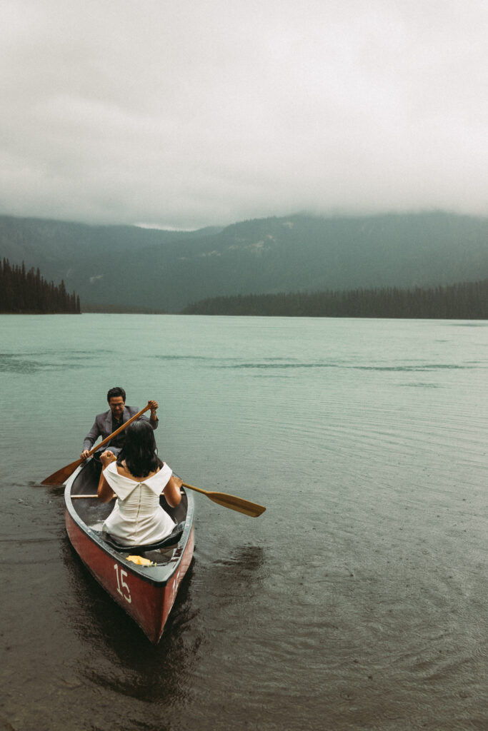 This couple just finished their Banff Elopement and are enjoying the extra time in a canoe.